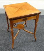 AN EDWARDIAN MAHOGANY ENVELOPE CARD-TABLE on shaped and reeded supports with lower tier plant-