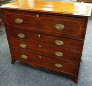 AN INLAID MAHOGANY FOUR DRAWER SECRETAIRE the top drawer hinging and dropping to reveal a neat