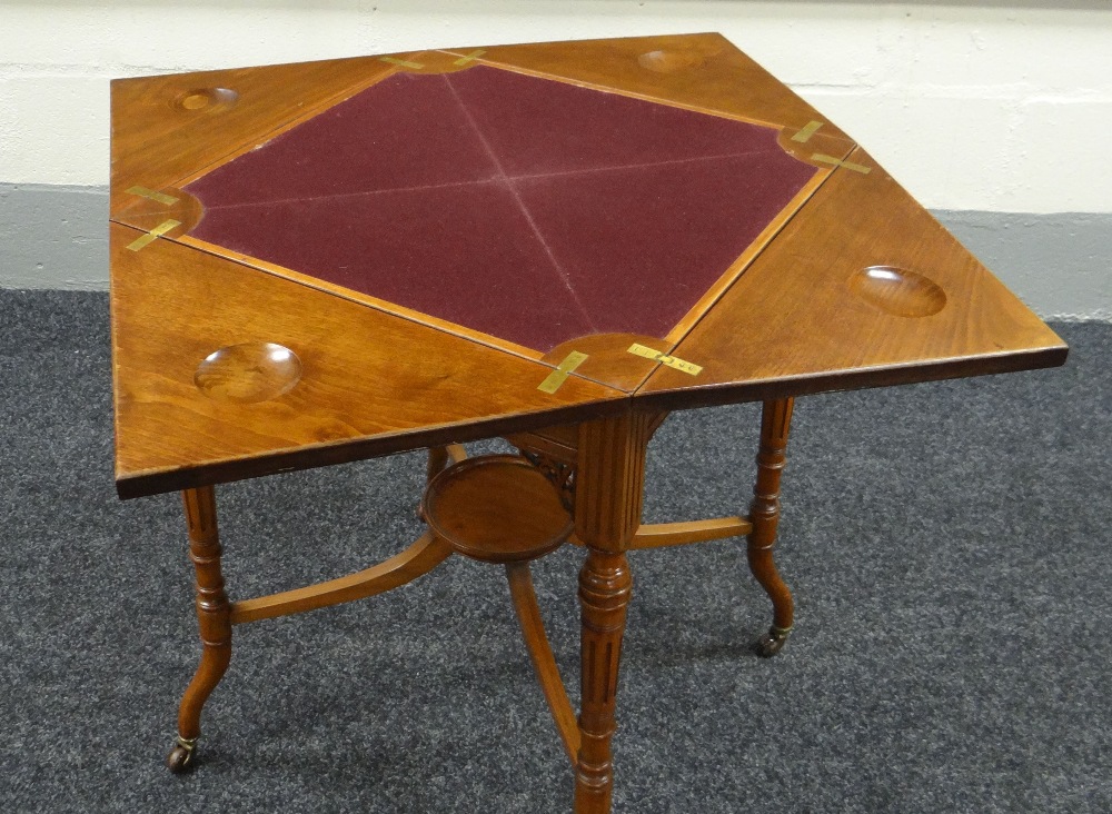 AN EDWARDIAN MAHOGANY ENVELOPE CARD-TABLE on shaped and reeded supports with lower tier plant- - Image 2 of 3