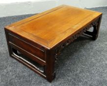 A CHINESE ROSEWOOD COFFEE TABLE with fretwork frieze, 90cms long