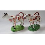 TWO SPONGED COW CREAMERS both on grassy bases (damage)