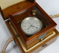 A THOMAS MERCER LTD NAUTICAL CHRONOMETER No.28343 bearing Arabic numerals to the silvered dial and