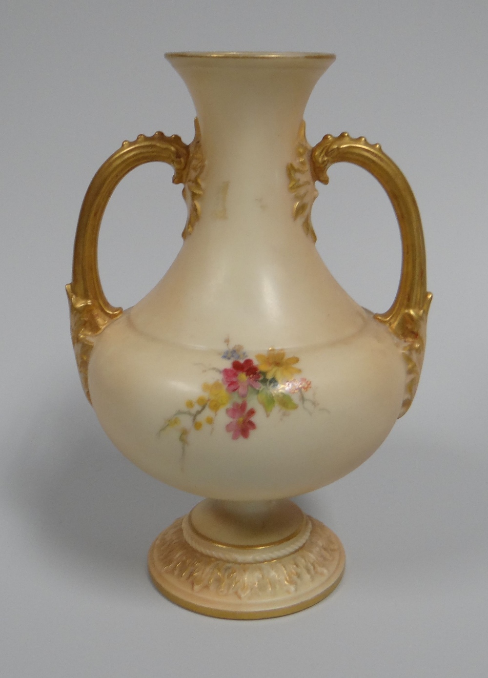 A SMALL ROYAL WORCESTER BLUSH VASE with twin-handles on a circular foot and the body painted with - Image 2 of 2