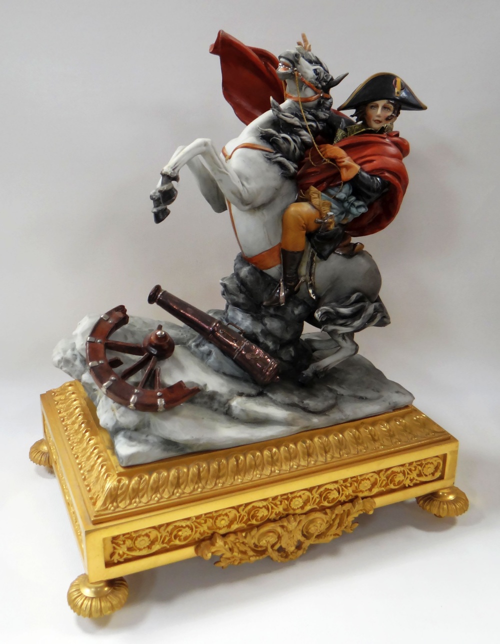 A CAPODIMONTE SCULPTURE 'NAPOLEON CROSSING THE ALPS' composed of the figure riding a bucking horse