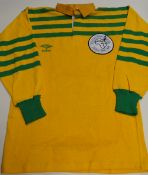 A SPORT AID INTERNATIONAL SEVENS jersey in yellow with green, the reverse bearing No.7 to a stitched