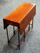 A DELICATE MAHOGANY SUTHERLAND TEA TABLE on turned and block supports, 81cms long