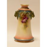 A HADLEY WORCESTER TAPERED VASE with twin lion-head handles and painted with flowers, 14cms high