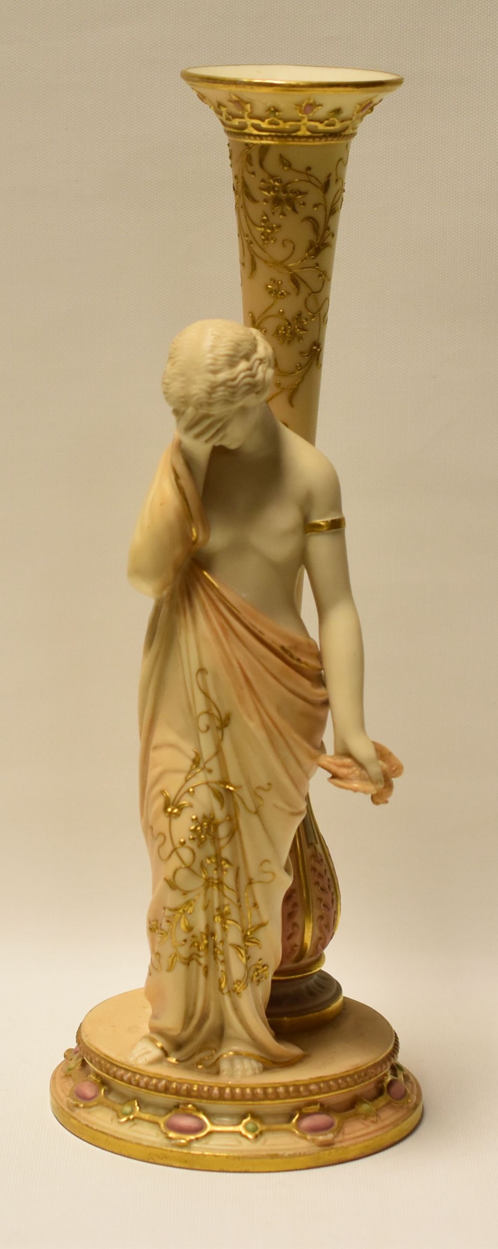 A ROYAL WORCESTER FIGURAL VASE in the Classical style with sorrowful robed lady holding a dead