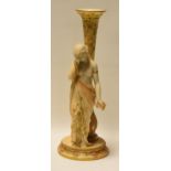 A ROYAL WORCESTER FIGURAL VASE in the Classical style with sorrowful robed lady holding a dead