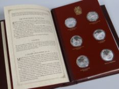 A FOLDER SET OF TWENTY-FOUR JOHN PINCHES SILVER MEDALLIONS to commemorate 100 years since the