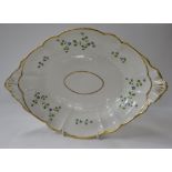 A SWANSEA PORCELAIN CENTRE DISH with cornflower decoration and twin handles (restored), 36cms long