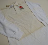 AN ENGLAND INTERNATIONAL RUGBY UNION SQUAD JERSEY, bearing stitched felt No. 19 to reverse and