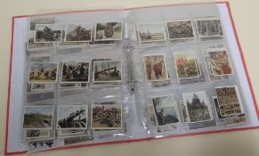 A COLLECTION OF GERMAN MILITARY RELATED CIGARETTE CARDS contained within a modern folder of