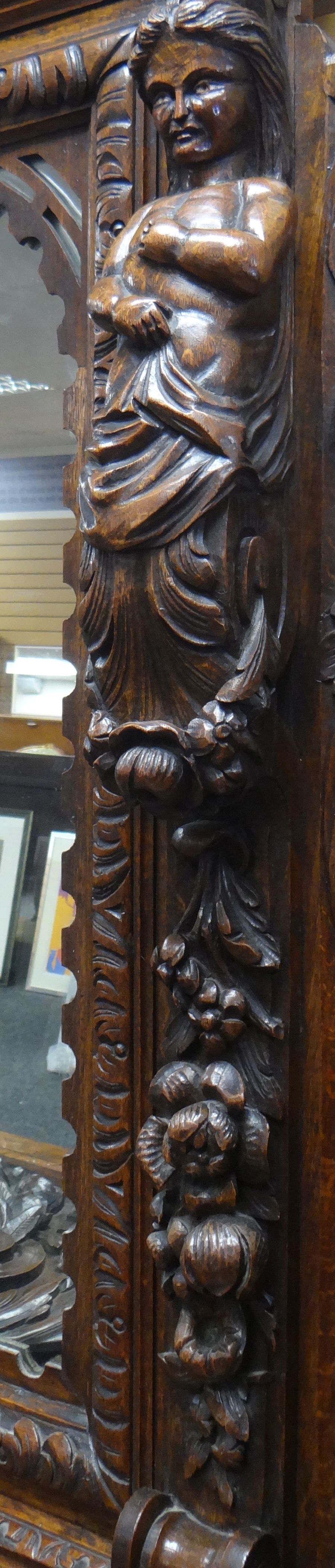 AN IMPOSING OAK MIRROR BACK PEDESTAL SIDEBOARD heavily and impressively carved all-round with - Image 6 of 6