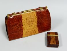 A CROCODILE SKIN HANDBAG & MATCHING CIGARETTE BOX, the handbag marked Germany to the yellow metal