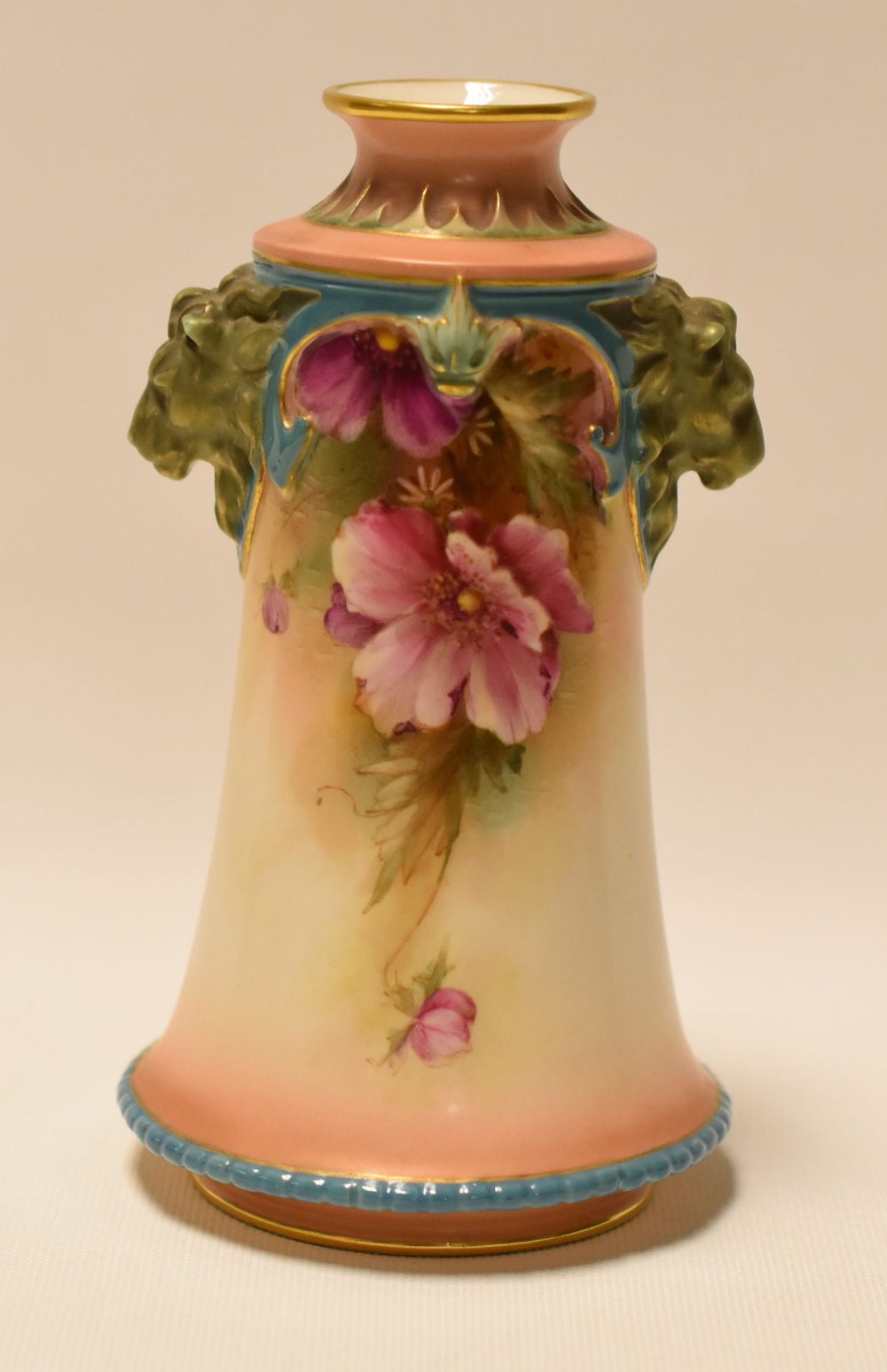 A HADLEY WORCESTER TAPERED VASE with twin lion-head handles and painted with flowers, 14cms high - Image 2 of 2