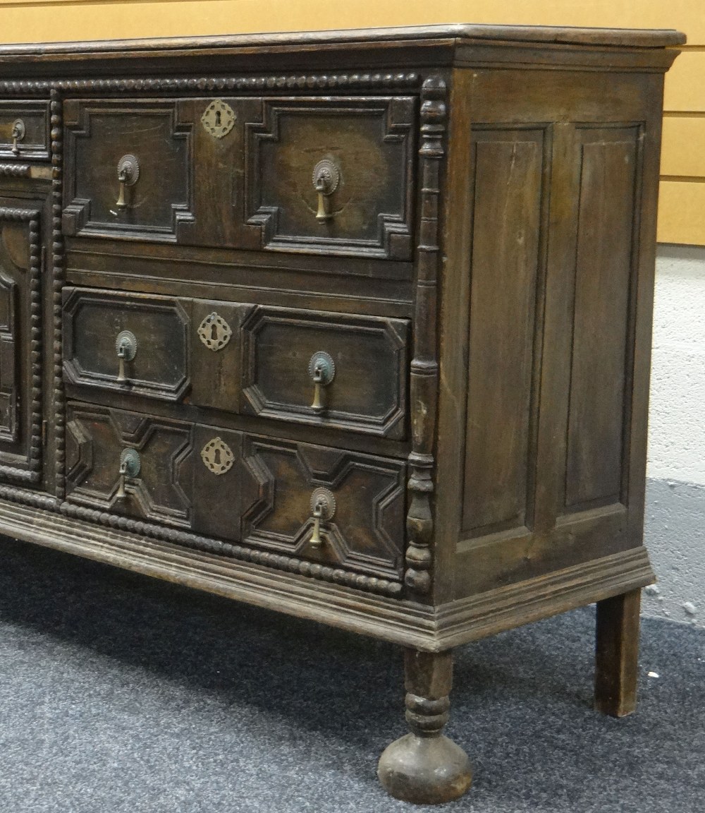 A JACOBEAN REVIVAL OAK SIDEBOARD with a centre single drawer and cupboard flanked by three drawers - Image 2 of 2