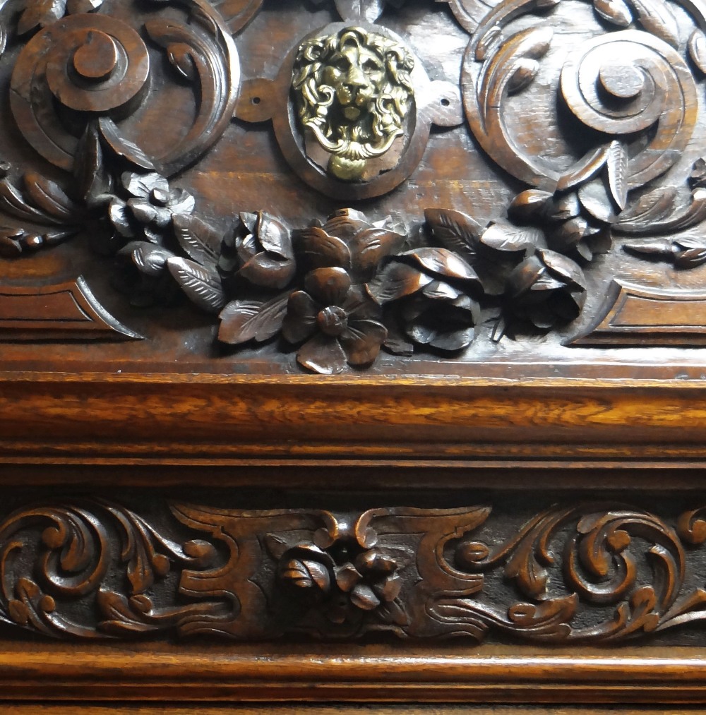AN IMPOSING OAK MIRROR BACK PEDESTAL SIDEBOARD heavily and impressively carved all-round with - Image 4 of 6
