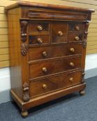 A VICTORIAN MAHOGANY CHEST OF DRAWERS composed of three graduated lower drawers, centre upper top-