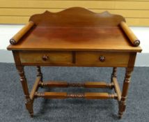 A MAHOGANY WASHSTAND with two drawers and rail-back, 95cms wide