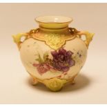 A SMALL ROYAL WORCESTER GLOBULAR VASE with serpent twin-handles and raised on four feet, painted