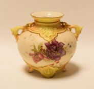 A SMALL ROYAL WORCESTER GLOBULAR VASE with serpent twin-handles and raised on four feet, painted