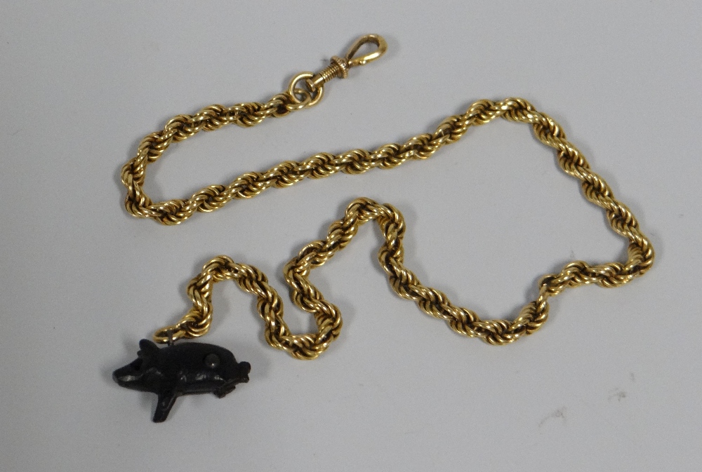 A BELIEVED GOLD (UNMARKED) ROPE TWIST CHAIN WITH STANHOPE in the form of a pig featuring 'A Memory