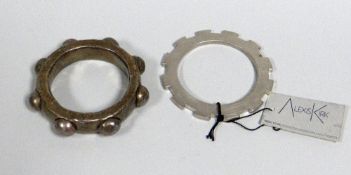 TWO ALEXIS KIRK (1936-2010) DESIGNED BRACELETS one with label and titled 'In Gear'