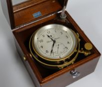 A THOMAS MERCER LTD NAUTICAL CHRONOMETER No.27035 bearing Roman numerals to the silvered dial and