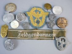 A COLLECTION OF GERMAN TINNIES AND POLICE BADGES, nine various propaganda badges including Adolf