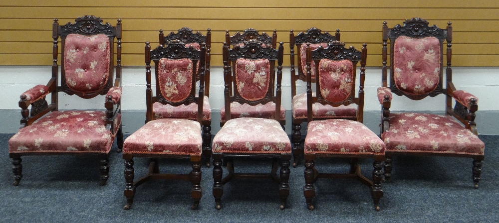 A CARVED MAHOGANY & UPHOLSTERED DRAWING ROOM SUITE OF EIGHT comprising two open armchairs and six