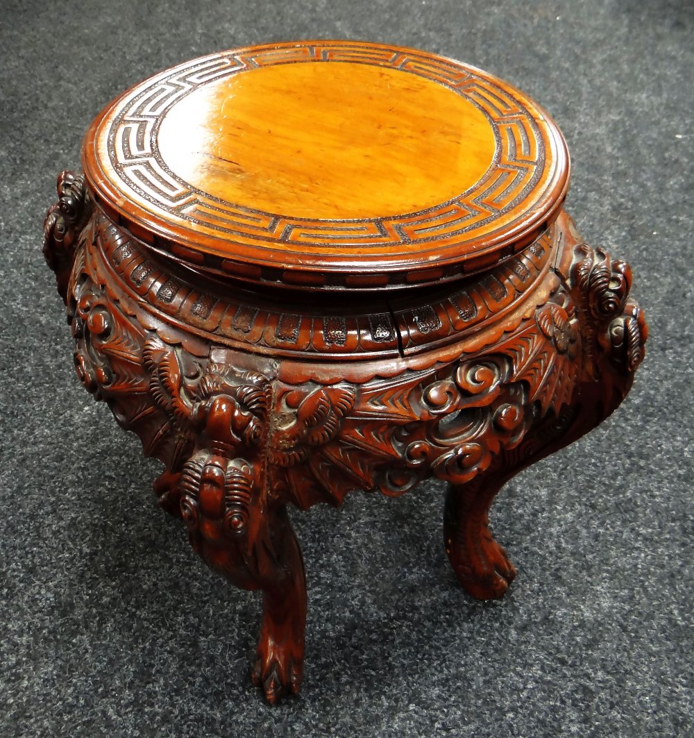 A CHINESE CARVED ROSEWOOD PEDESTAL 32cms diam top