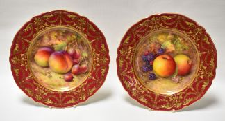 A PAIR OF ROYAL WORCESTER FRUIT PLATES BY RICHARD SEBRIGHT having gilt decoration to the Venetian-