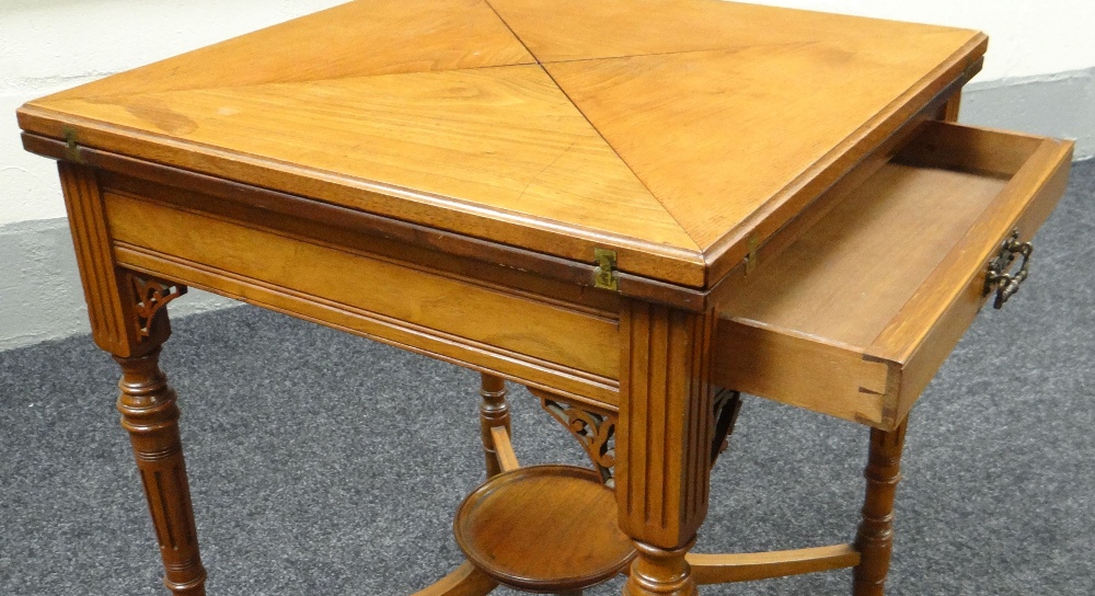 AN EDWARDIAN MAHOGANY ENVELOPE CARD-TABLE on shaped and reeded supports with lower tier plant- - Image 3 of 3