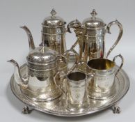 A FINE QUALITY EPNS COFFEE & TEA SERVICE including footed circular tray, each element with elegant
