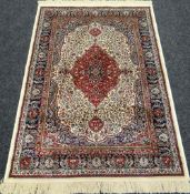 AN IVORY GROUND CASHMERE RUG with medallion design, 159 x 116cms