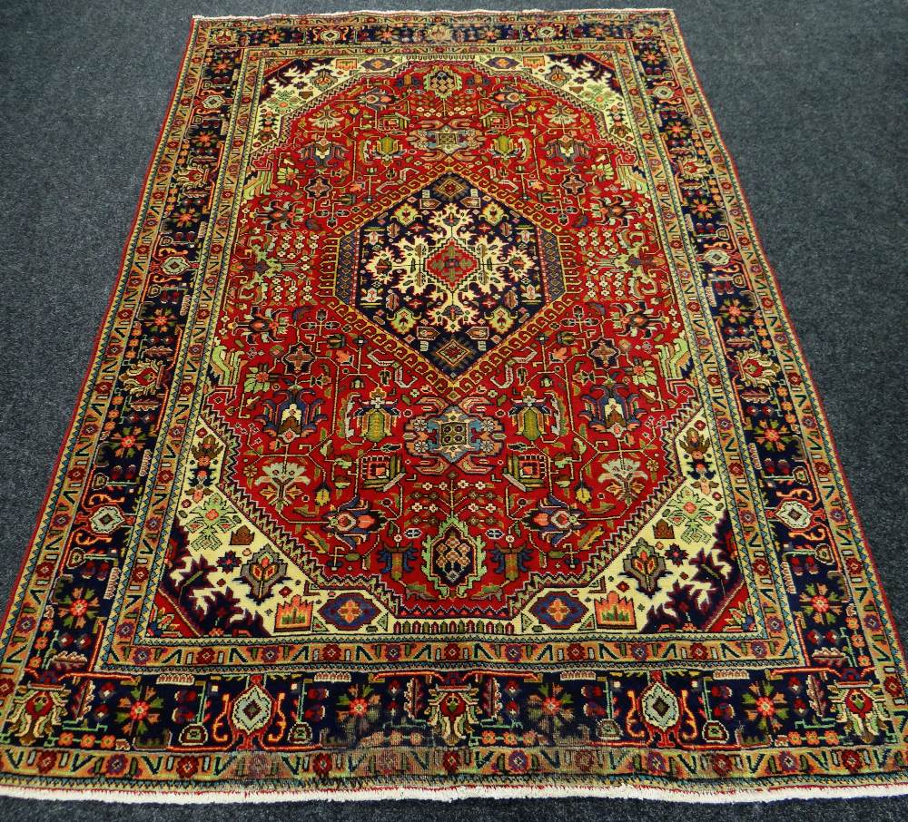 A PERSIAN TABRIZ CARPET multicoloured unique medallion design, 298 x 192cms