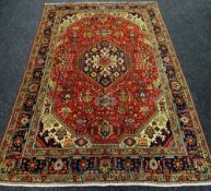 A PERSIAN TABRIZ CARPET multicoloured unique medallion design, 298 x 192cms