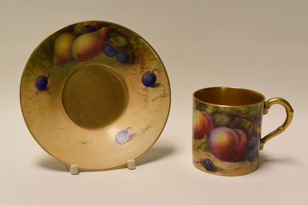 A ROYAL WORCESTER COFFEE-CAN & SAUCER decorated with fruit by W H Austin, date mark for 1923