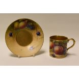 A ROYAL WORCESTER COFFEE-CAN & SAUCER decorated with fruit by W H Austin, date mark for 1923