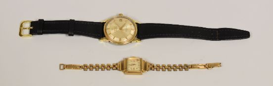 A GENT'S OMEGA CONSTELLATION AUTOMATIC WRISTWATCH with black leather strap (running) together with a