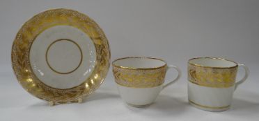 A PINXTON PORCELAIN 'PATTERN NO.1' TRIO comprising tea-cup, coffee-can and saucer, all with gilt