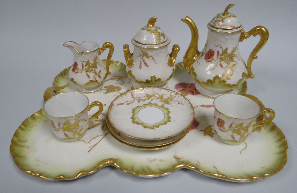 A CHARLES HAVILAND, LIMOGES CABARET SERVICE comprising tray, coffee-pot, cream-jug, lidded