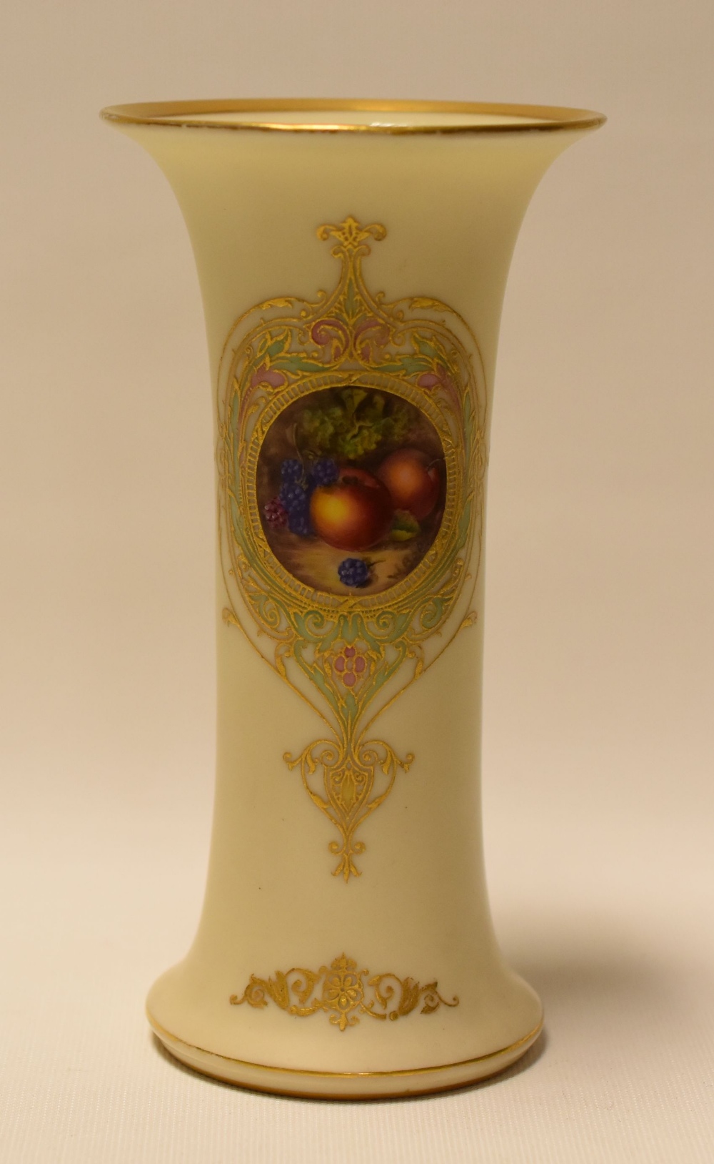 A ROYAL WORCESTER TRUMPET VASE in ivory ground, painted with a cartouche of fruit by William Bee,
