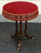 A LATE-VICTORIAN MAHOGANY TRIPOD TABLE with ornately floral carved supports, the circular top having