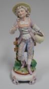 A CONTINENTAL PARIAN PORCELAIN FIGURE of a young girl in floral painted pantaloons and bonnet