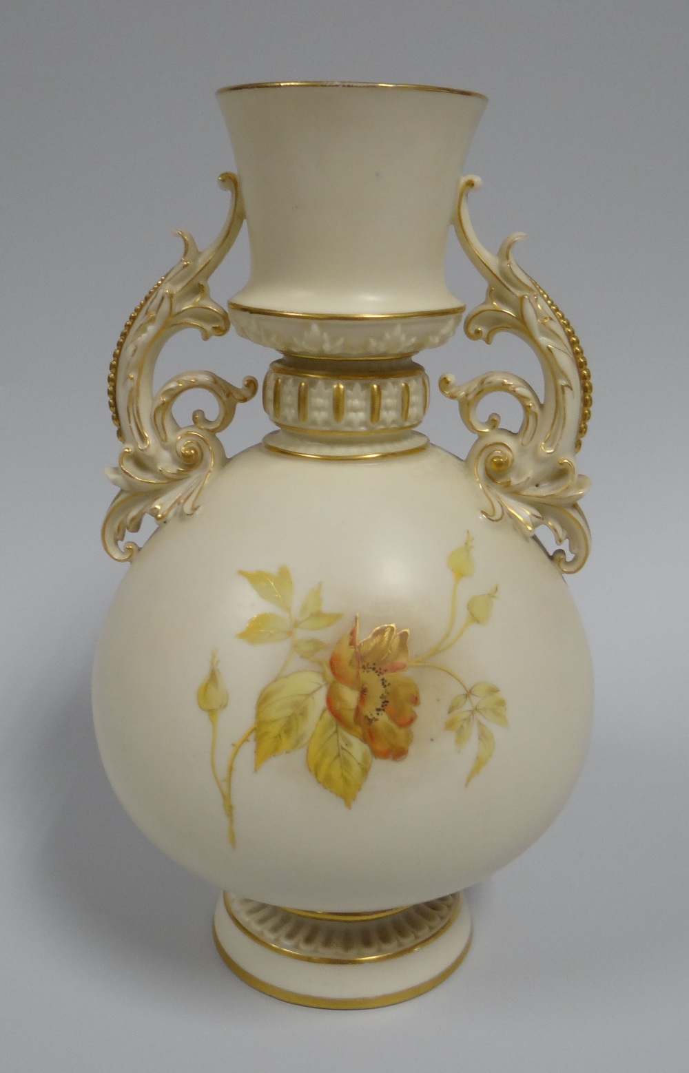 A ROYAL WORCESTER TWIN HANDLED VASE raised on a circular base, with tapered neck to the ovoid body - Image 2 of 2