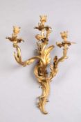 Dreiflammige Wandapplike.Frankreich 19. Jh. Louis-Qinze-Stil. Bronze, gegossen, ziseliert und