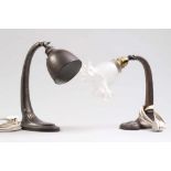 Zwei Tischlampen.Nach 1900. Metall, ovaler Sockel. H: bis 31 cm.