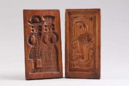 Zwei Holzmodeln.19. Jh. Holz, eine beidseitig beschnitzt in Form eines Löwen mit Schlange und